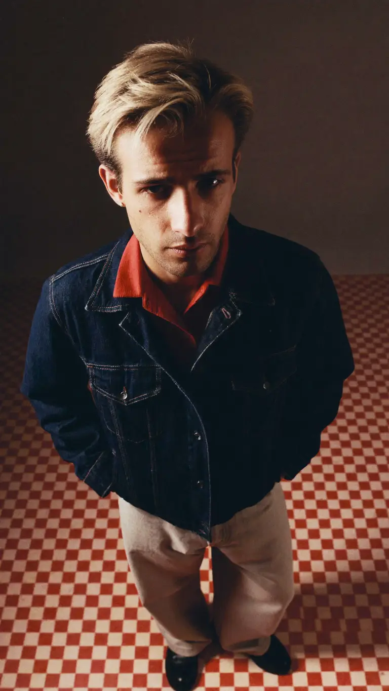 KAIRO VOSS — denim jacket, red checkered floor, editorial portrait